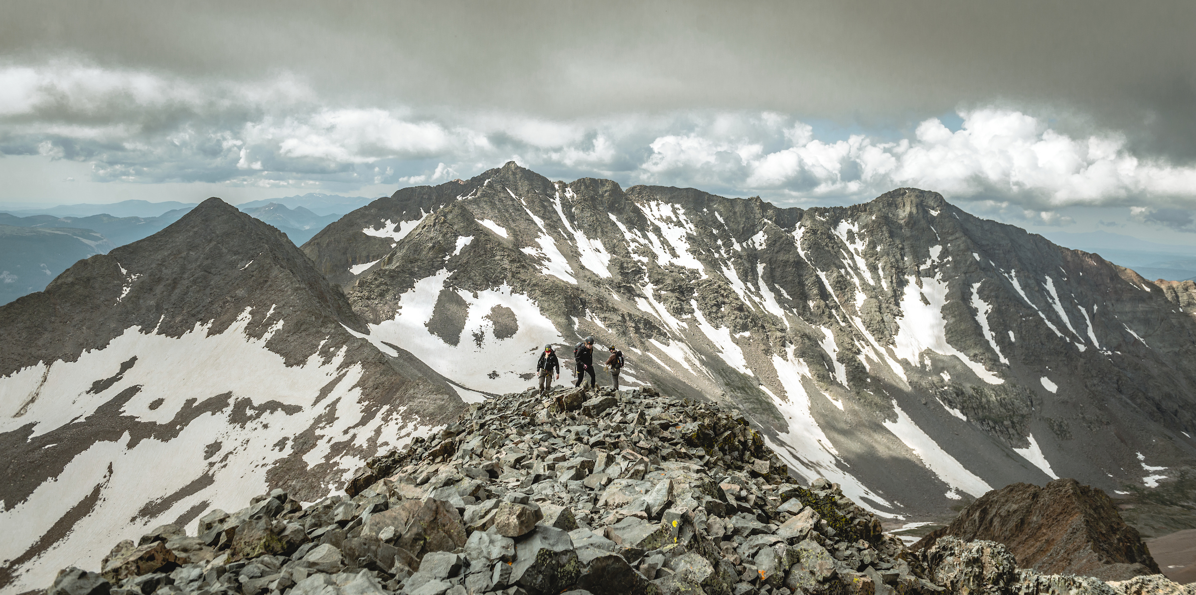 People atop the summit of Mount Wilson near Telluride, Colorado
