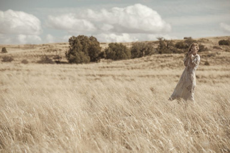 Fashion photographer Dylan H. Brown shoots a nude woman in tall grass