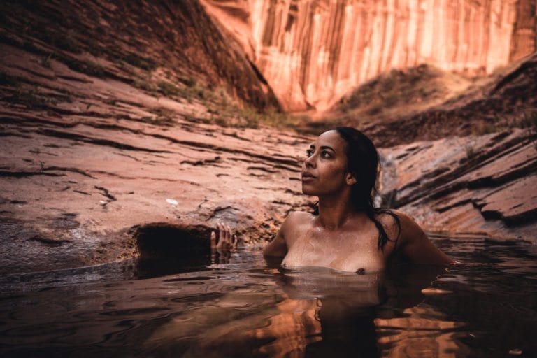 Leslie Hansen looks up while swimming in the cold water of Willow gulch