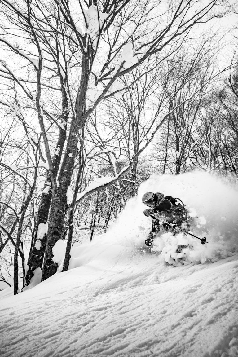 A man skis through deeps snow at Goryu ski resort in Japan