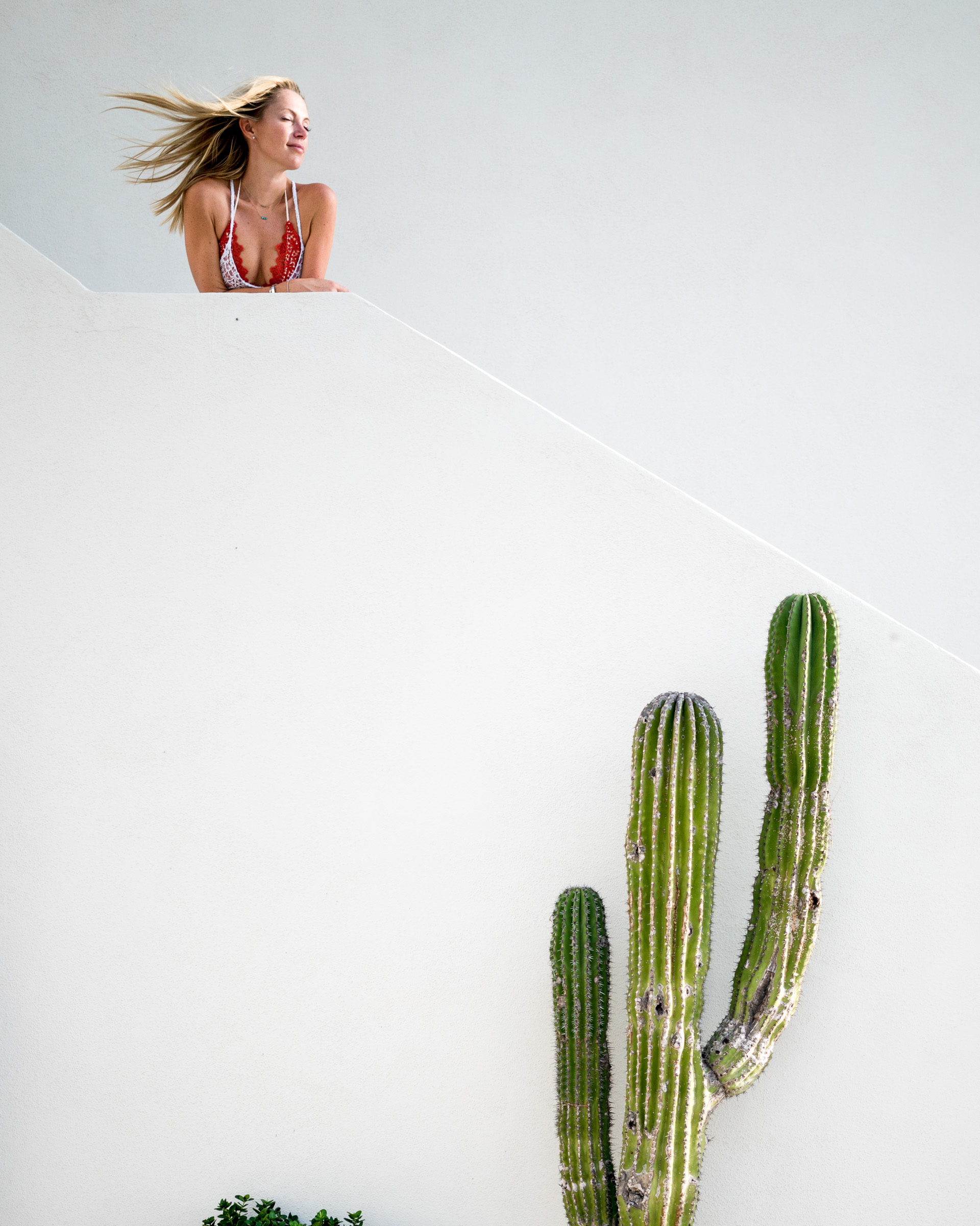 A woman poses for an Instagram photo at Hotel San Christobal in Todos Santos, Mexico
