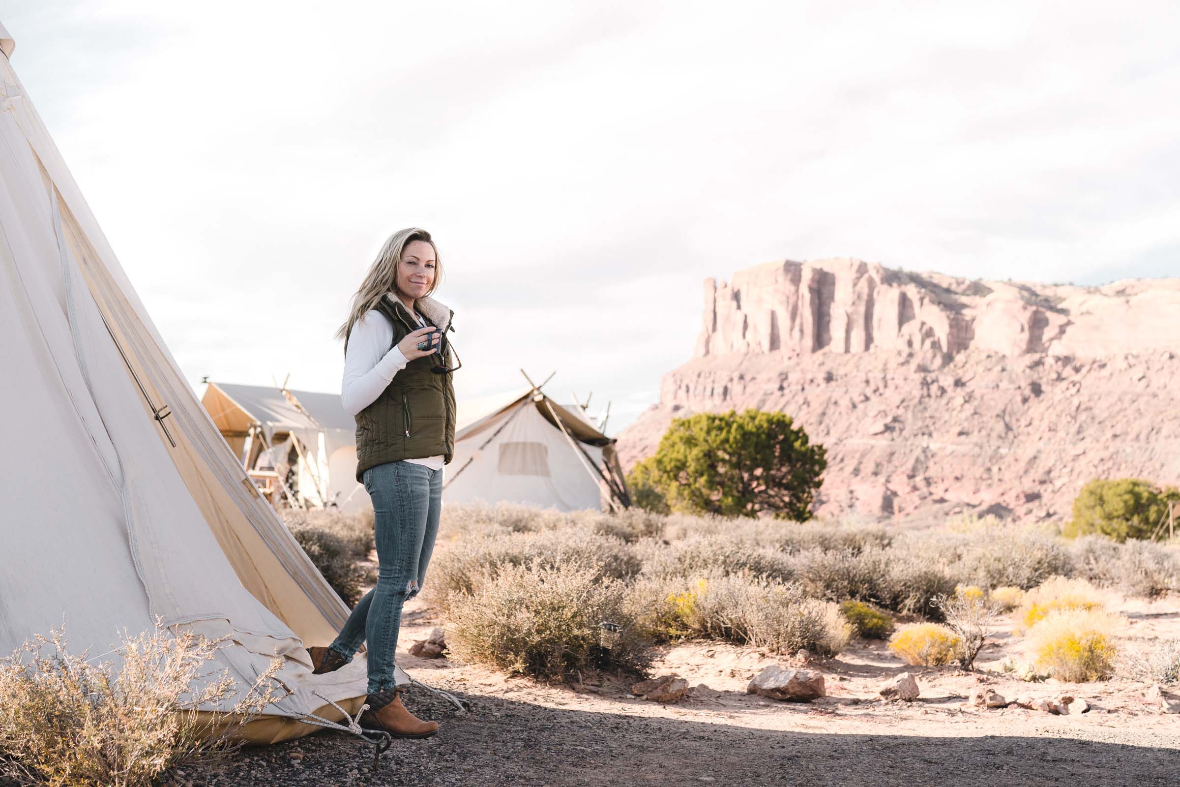 Sarah Herron walks out of a teepee at Undercanvas Moab
