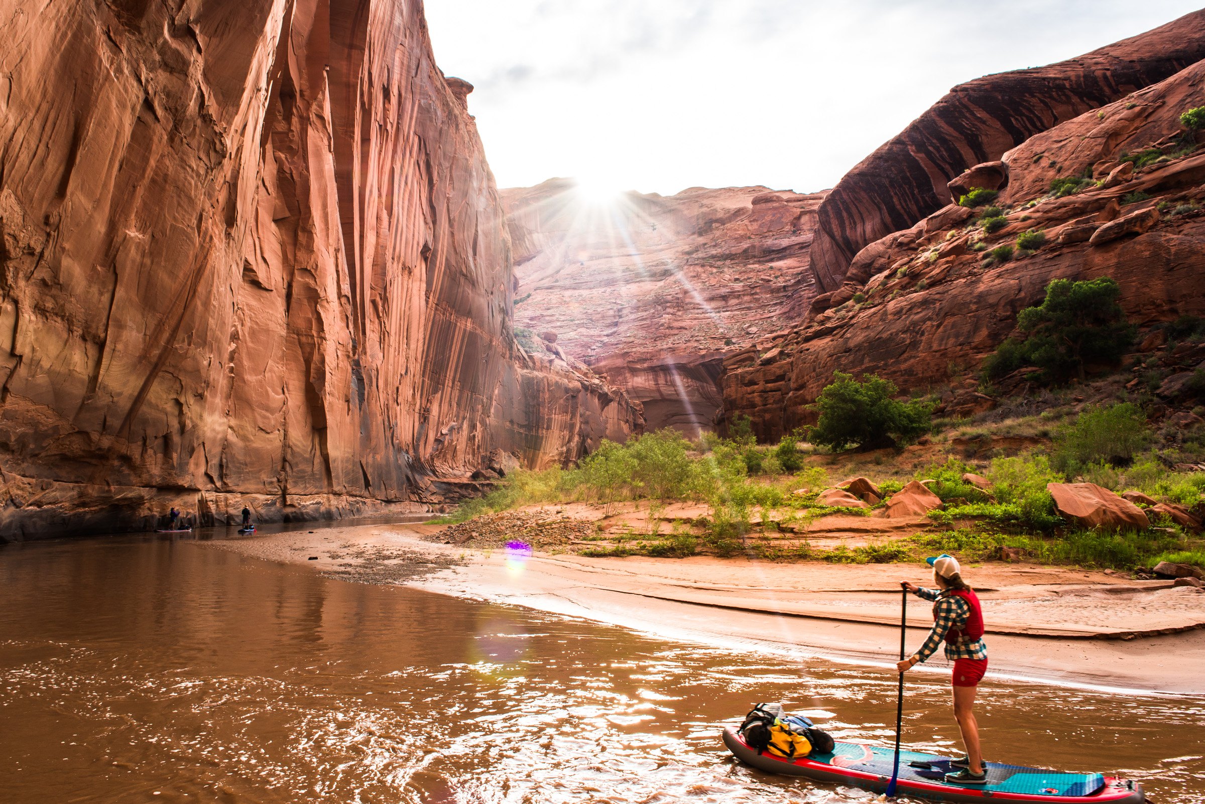 Morgan Tilton paddles into sunset on the Escalante River in southern Utah
