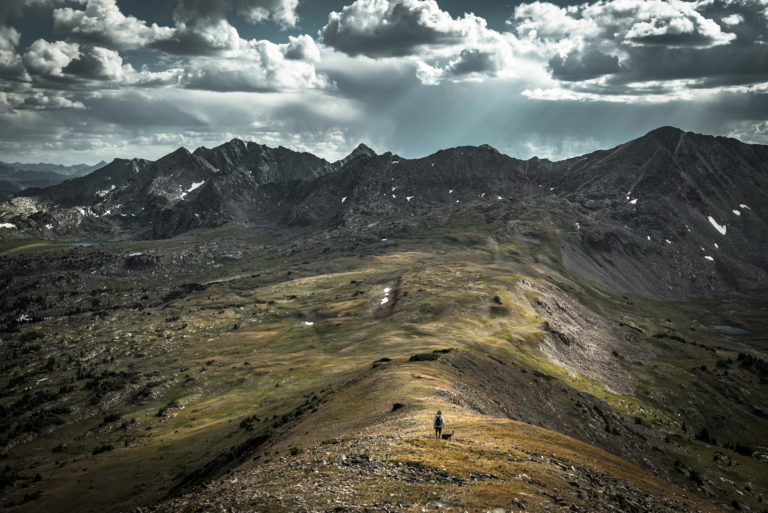 A hiker and his dog explore the Colorado high country.