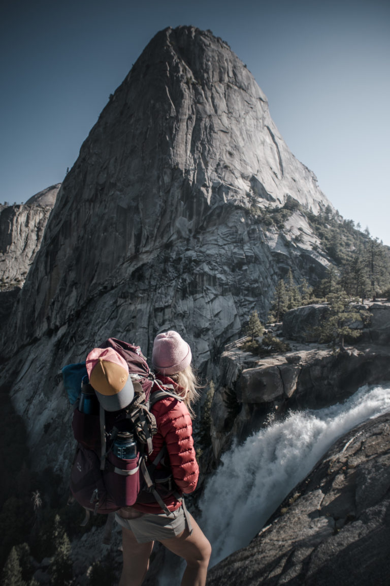 A backpacker looks over Nevada Falls in Yosemite National Park