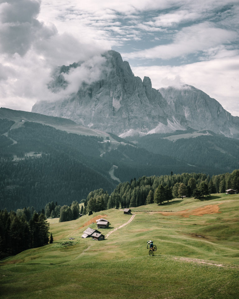 A man mountain bikes in the Dolomites