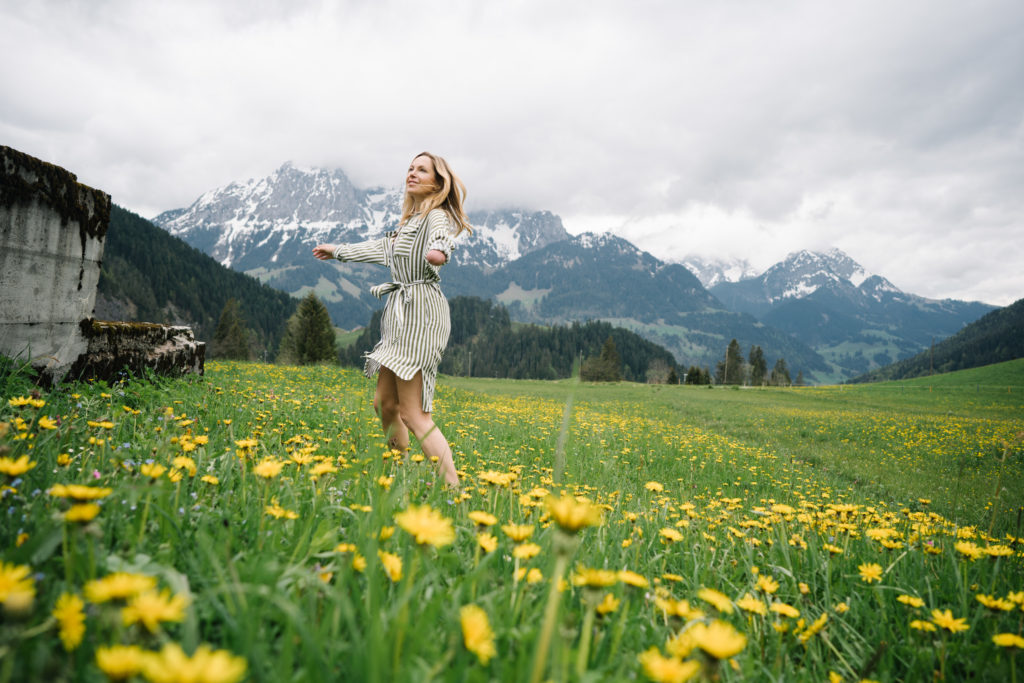 A woman in wildflowers in Switzerland.