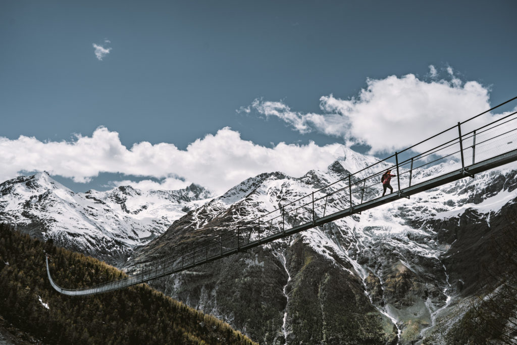 A woman crosses the longest suspension bridge in the world outside Zermatt, Switzerland