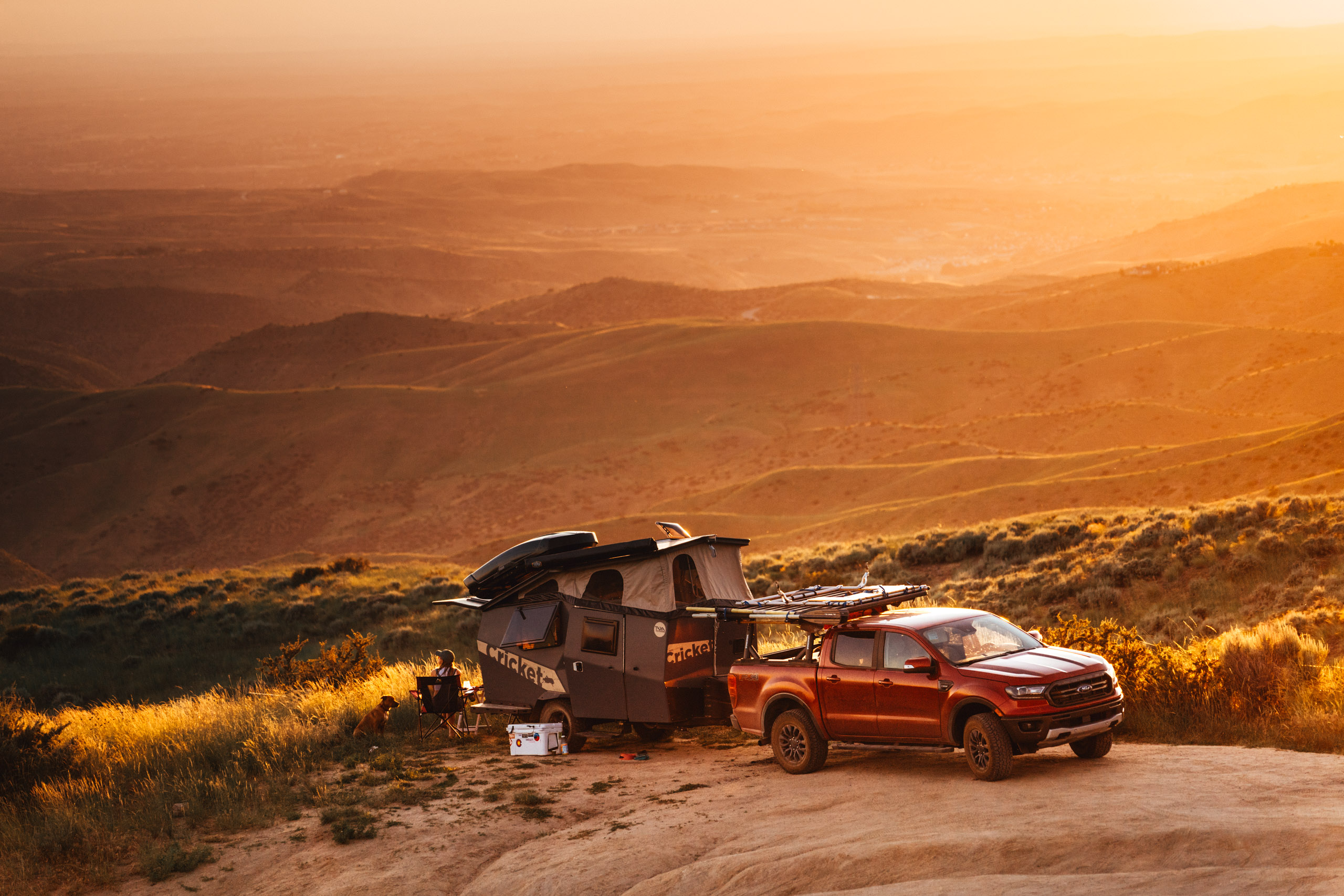 A Ford Ranger with a Taxa Outdoors habitat during sunset.